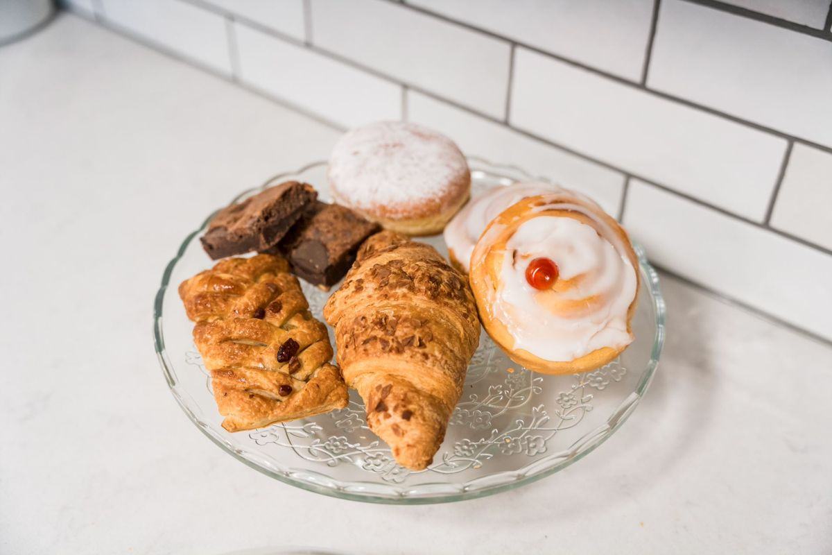 A plate of fresh pastries and cakes