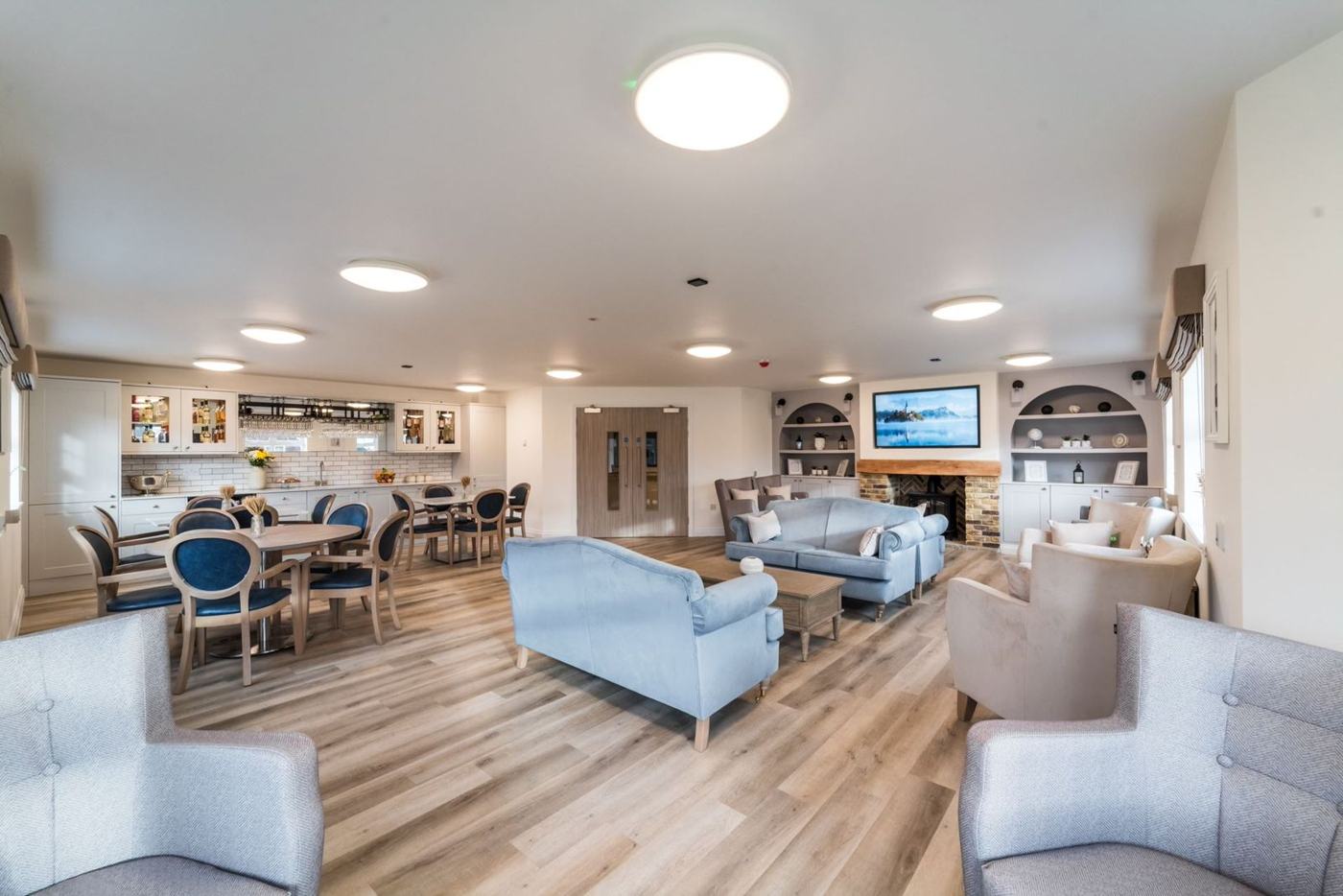 The bright lounge and dining room at Hampton Manor