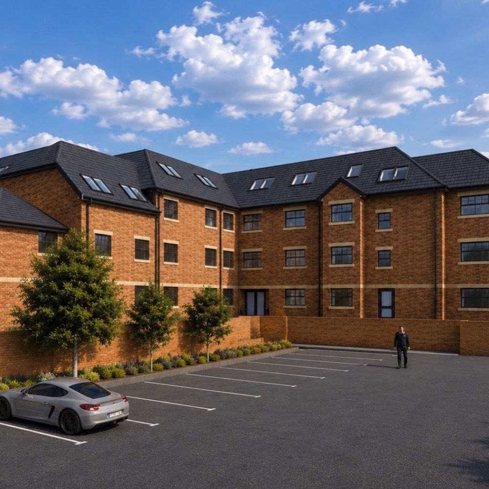Kensington House as it will look when complete, a four storey red brick care home with landscaped planting and parking